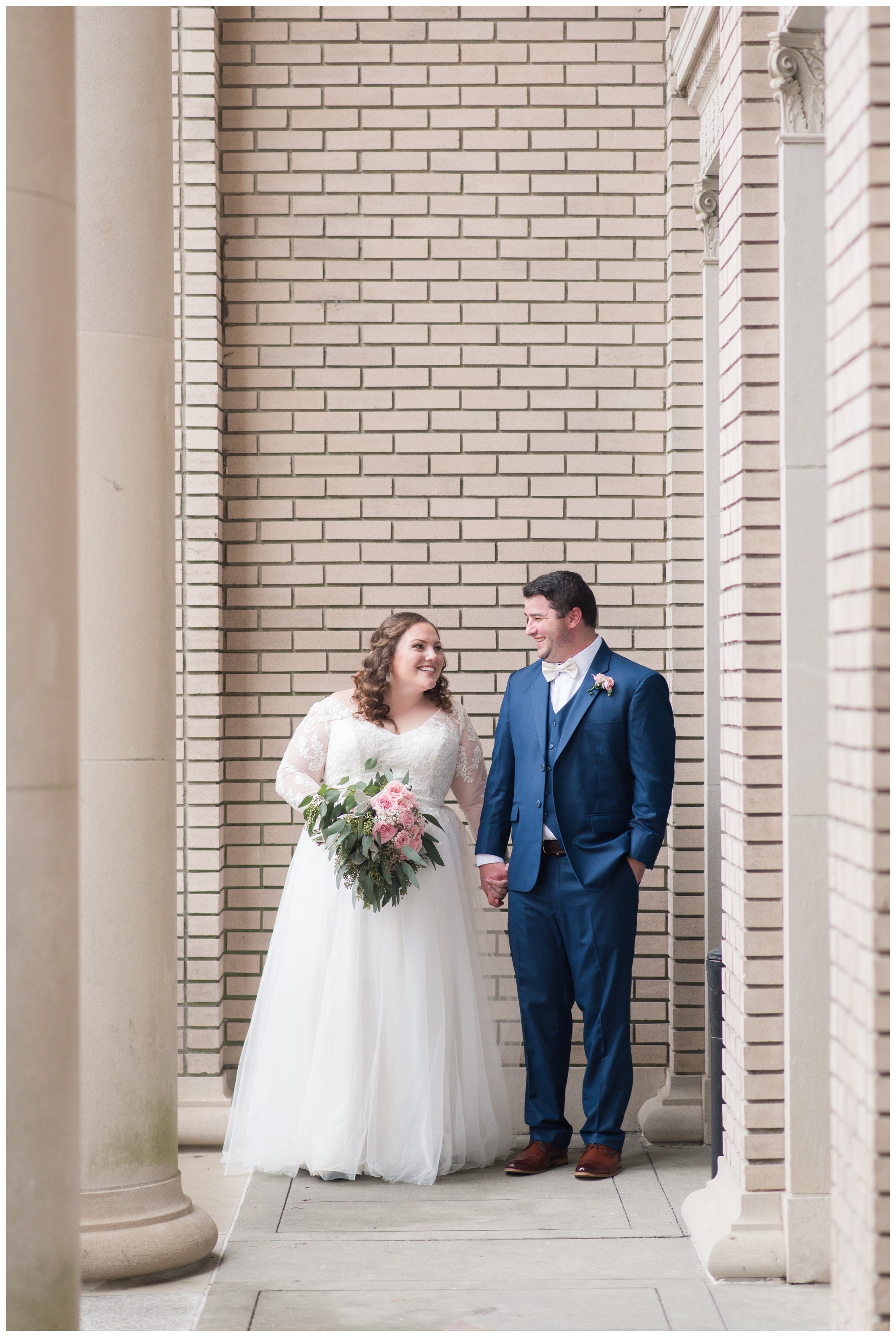 bride and groom at historic post office wedding by hampton roads wedding photographers