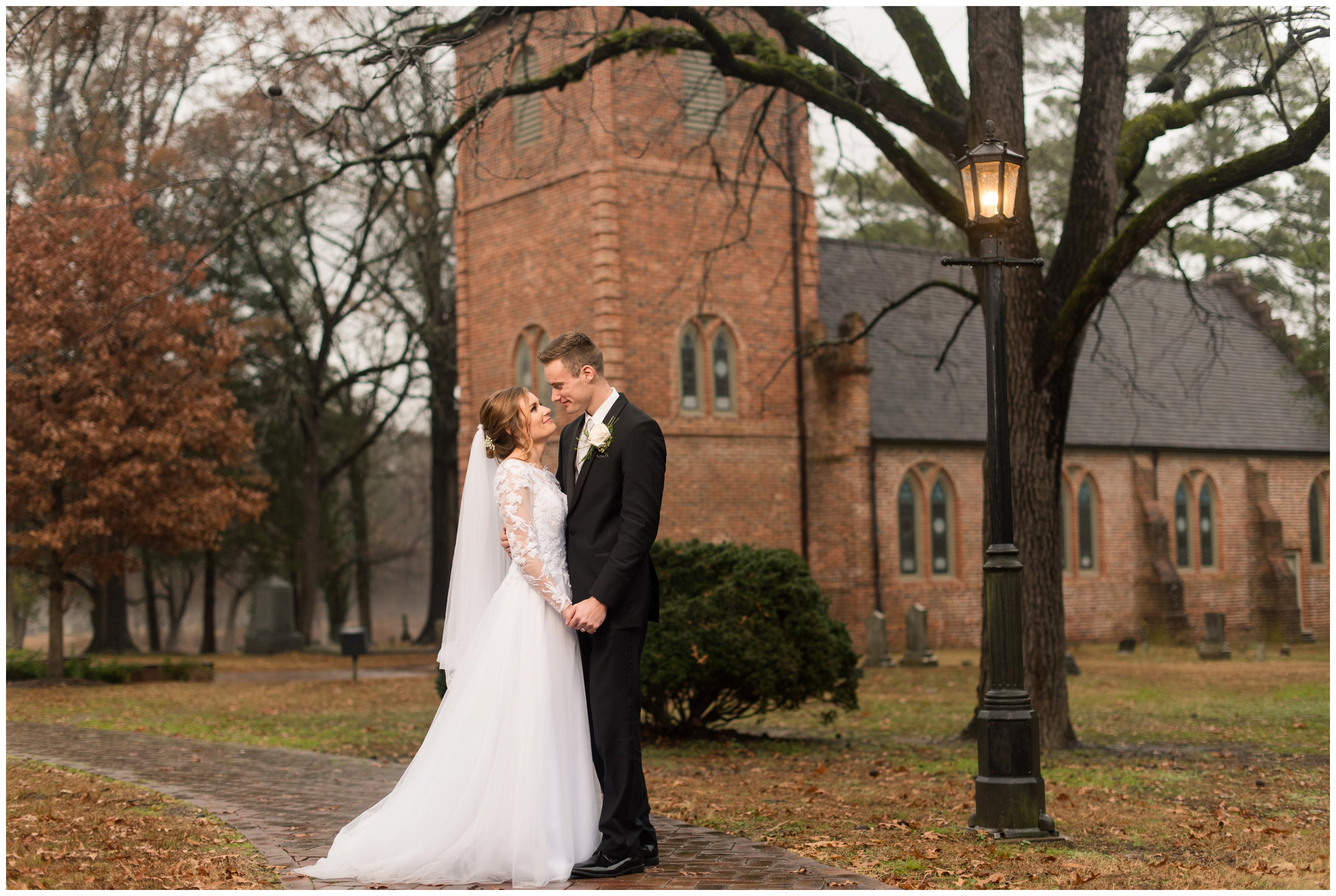 bride and groom on rainy wedding day at historic st lukes church in smithfield virginia