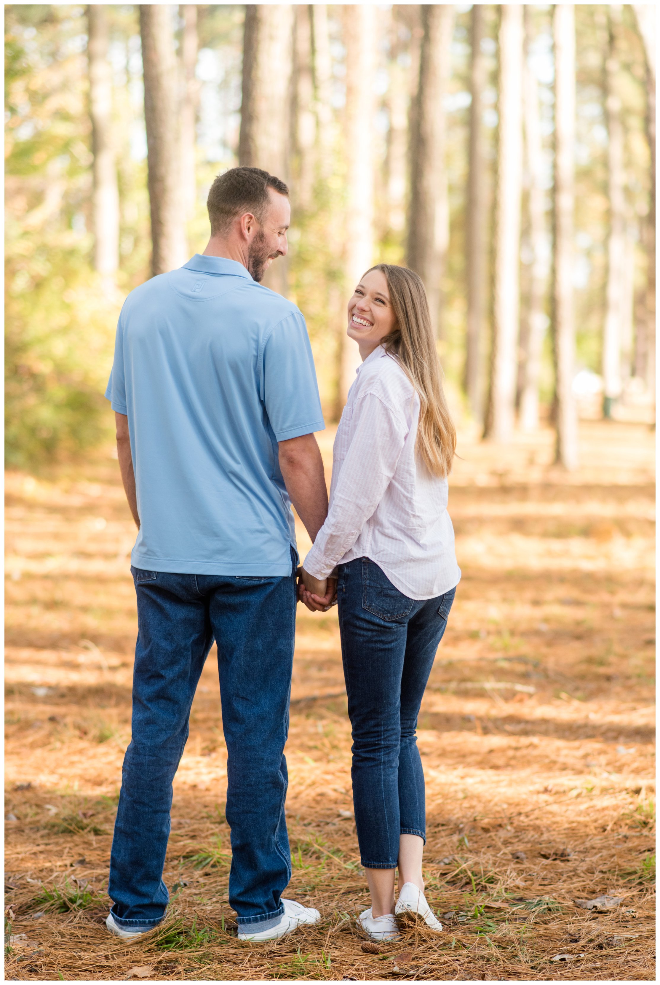couple smiling during chesapeake virginia engagement session by hampton roads wedding photographer