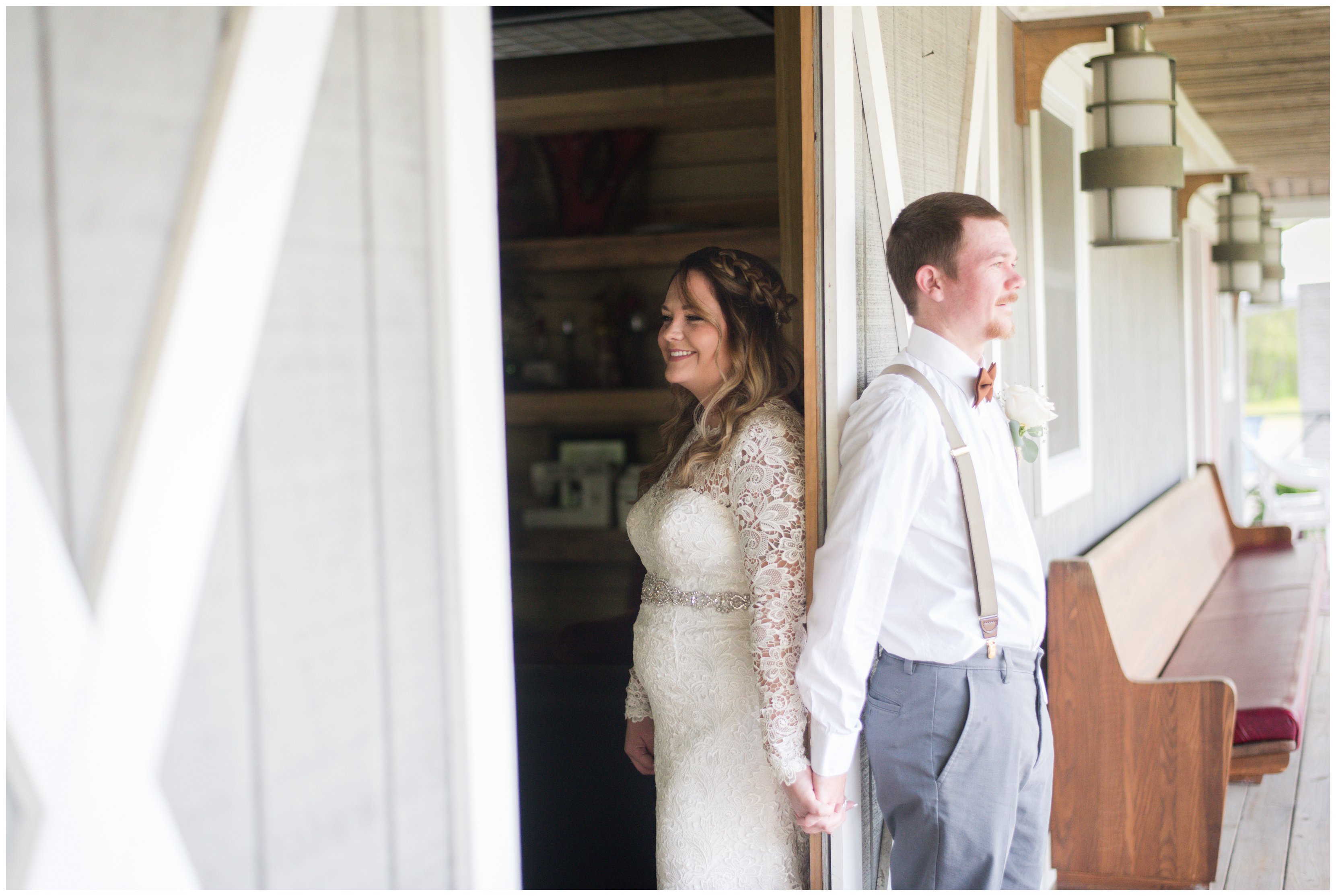 bride and groom hold hands around barn door at chesapeake va wedding
