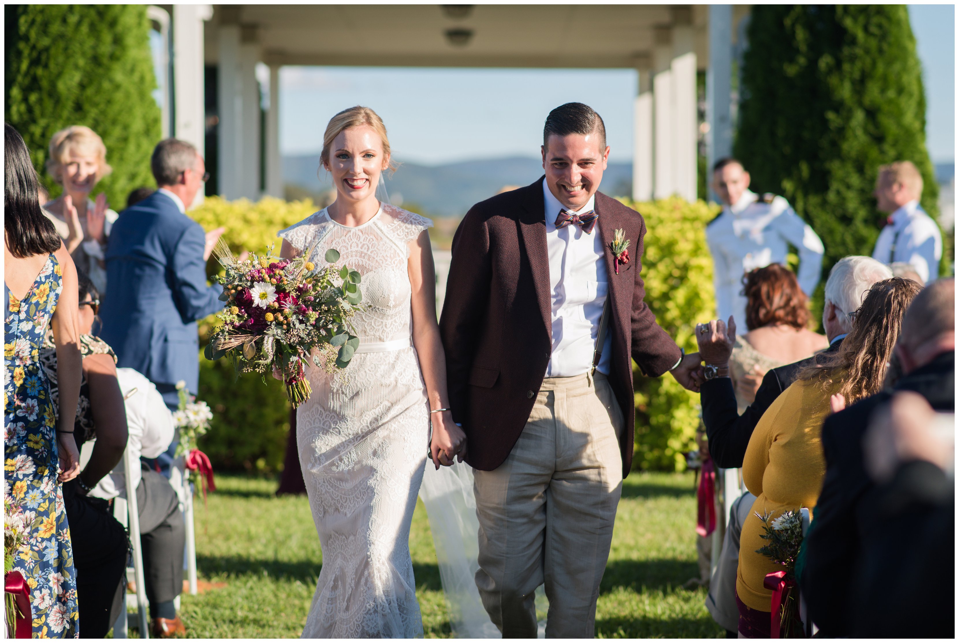 bride and groom walk down the aisle after hermitage hill farm wedding