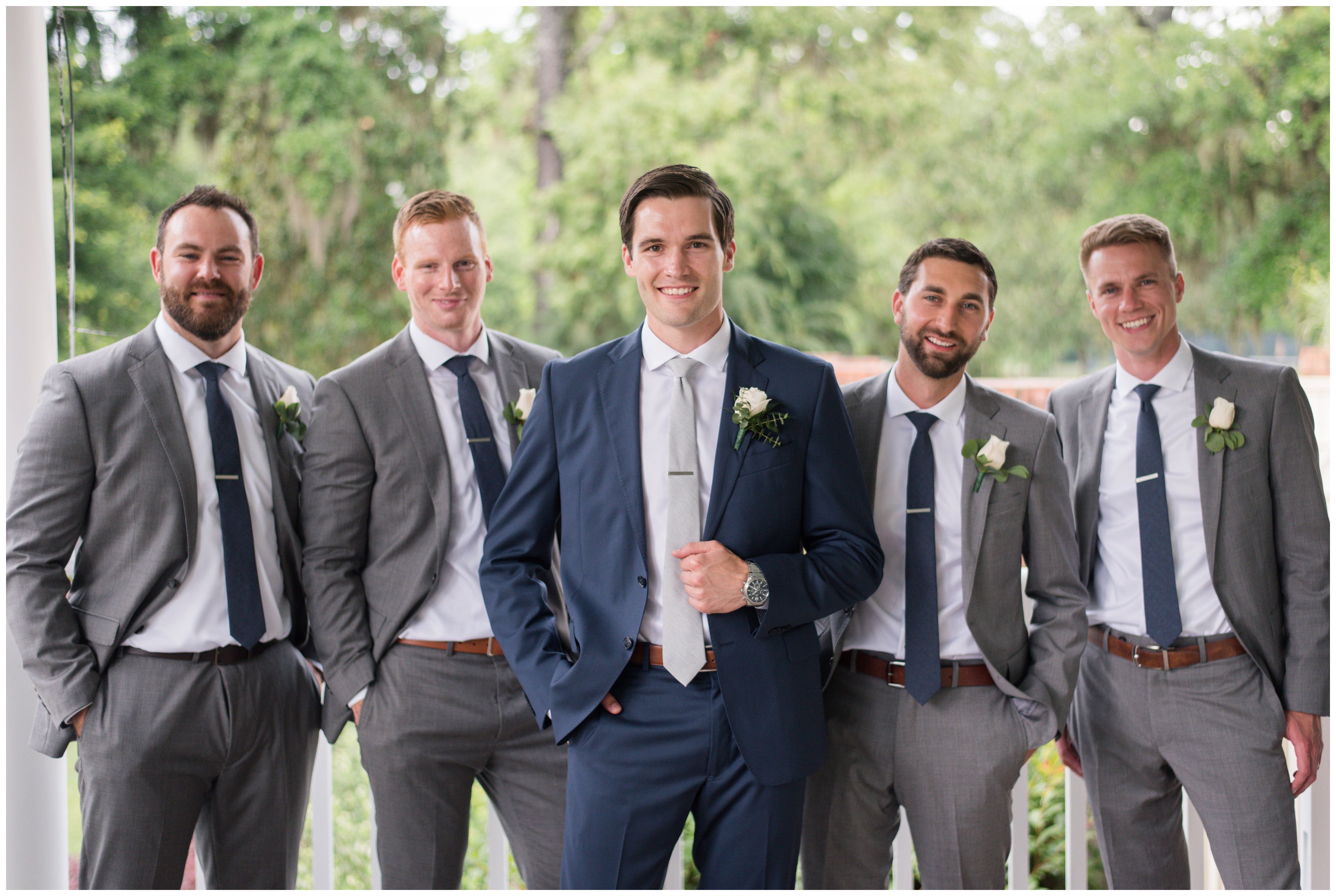 handsome groomsmen smile together during callwassie island wedding