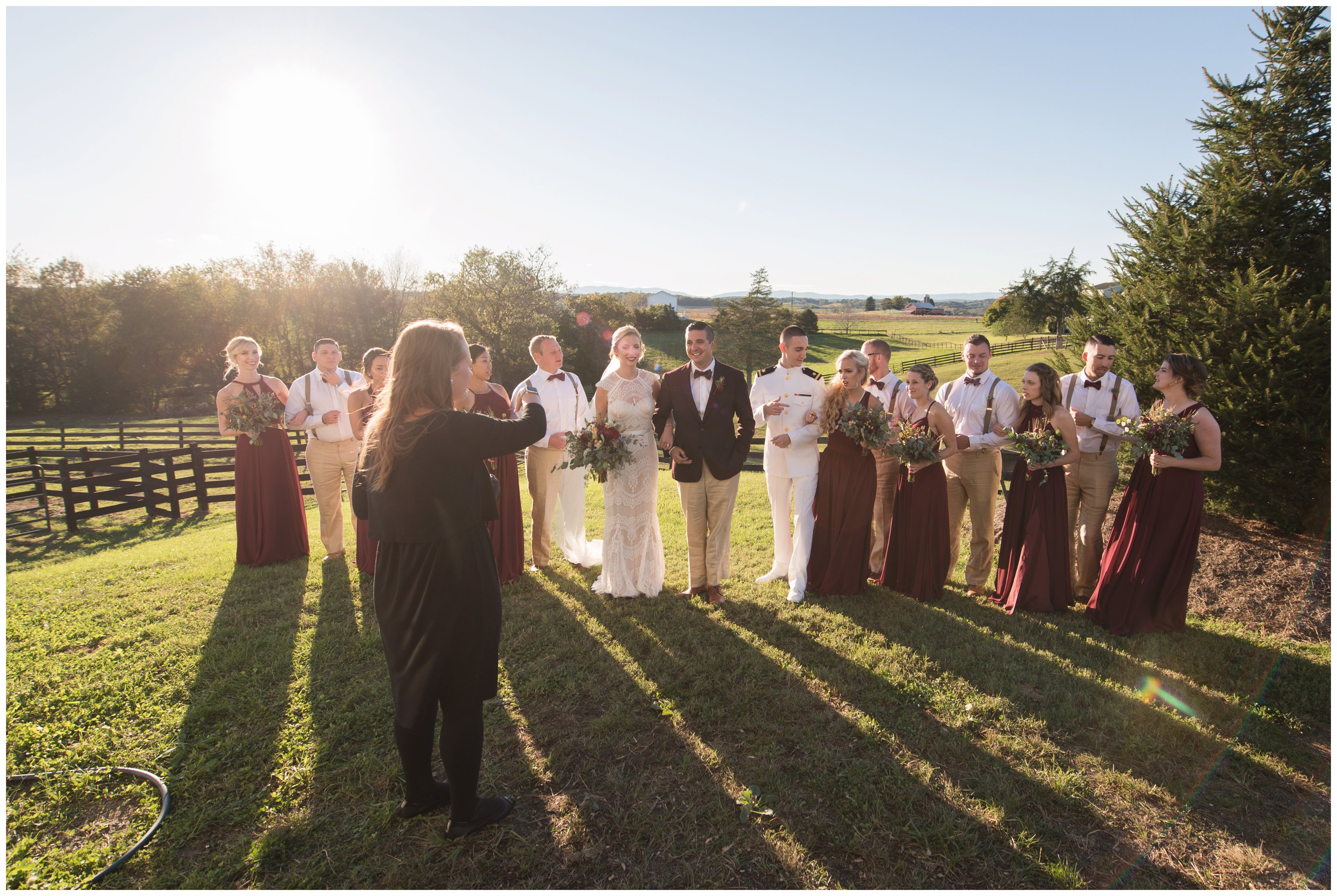 va photographer arranges bridal party during wedding day portraits