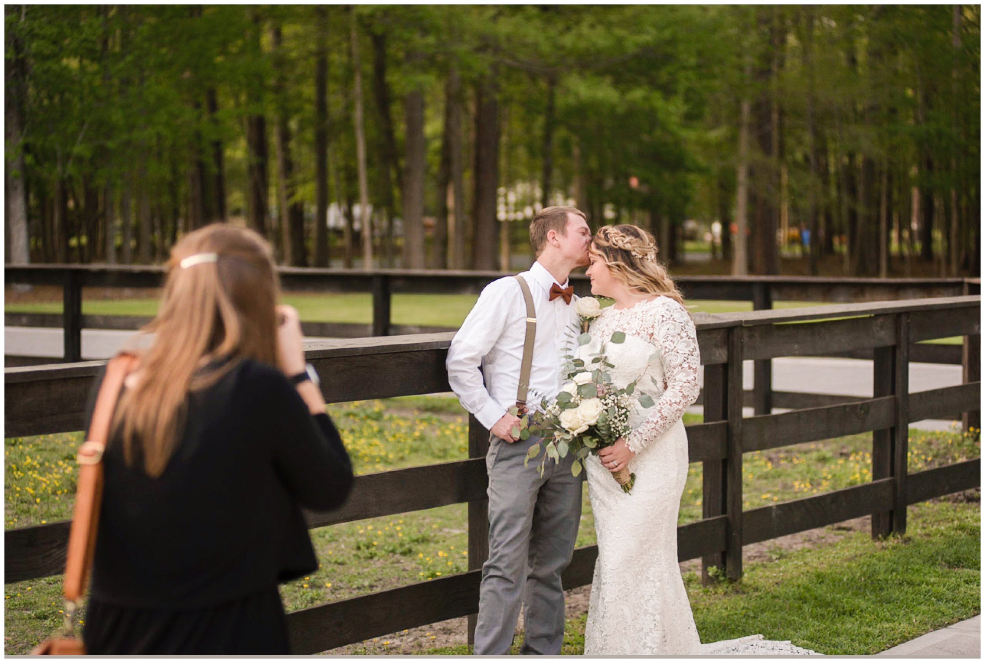 couple kisses during chesapeake wedding by hampton roads virignia wedding photographer