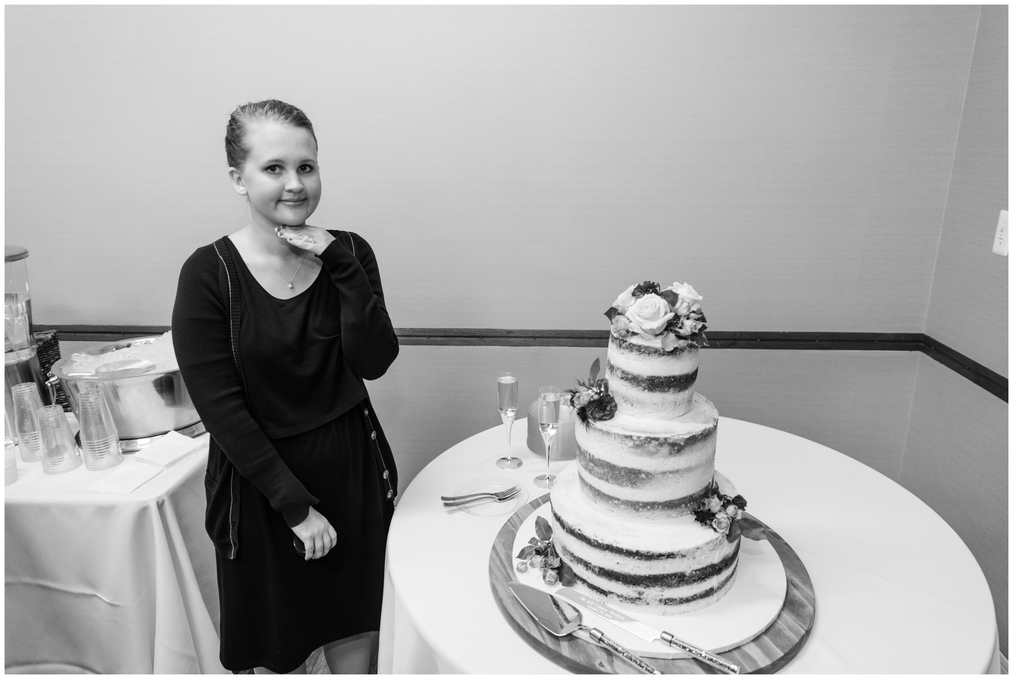 woman posing near wedding cake testing light