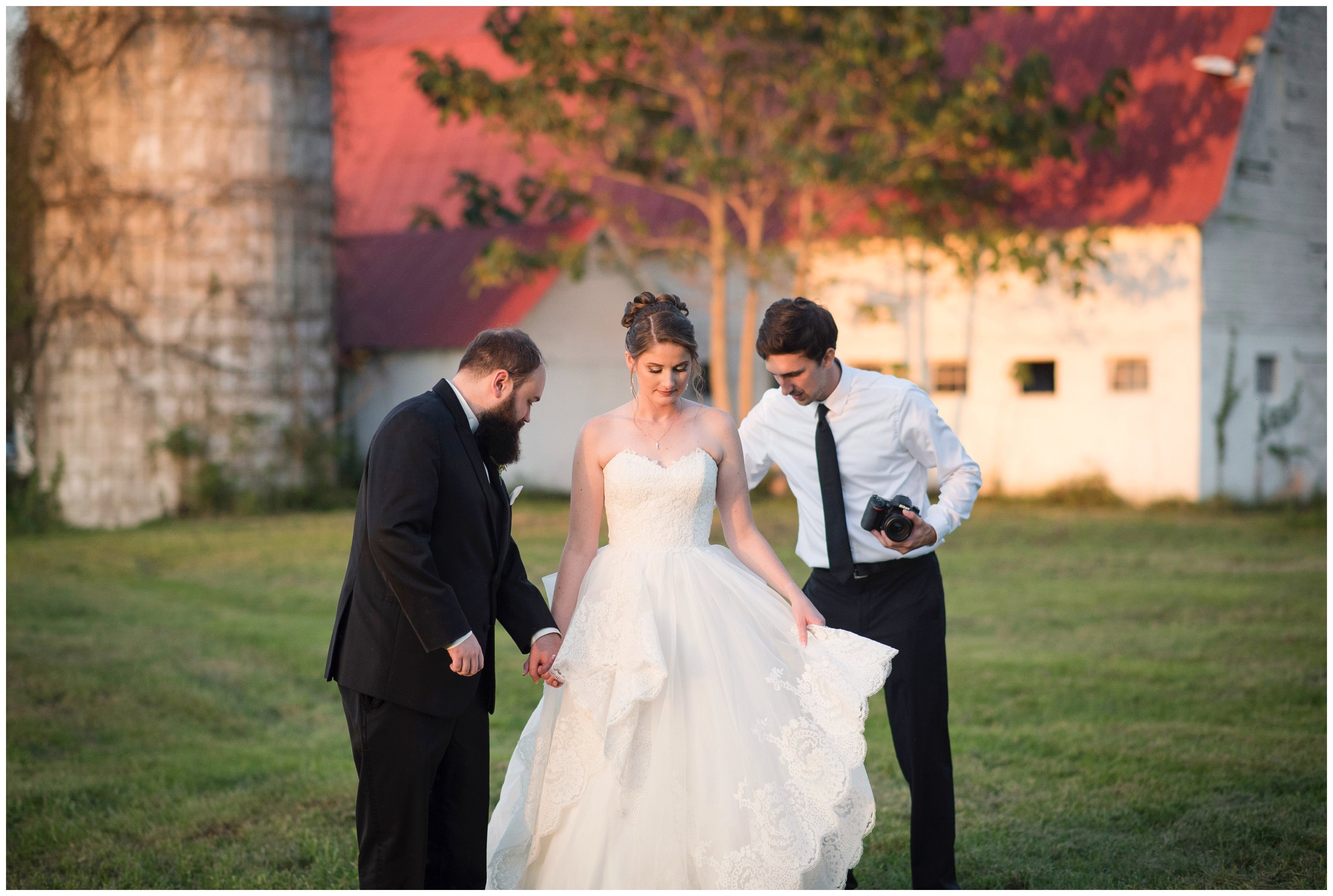 photographer fixes dress of bride at estate at white hall wedding