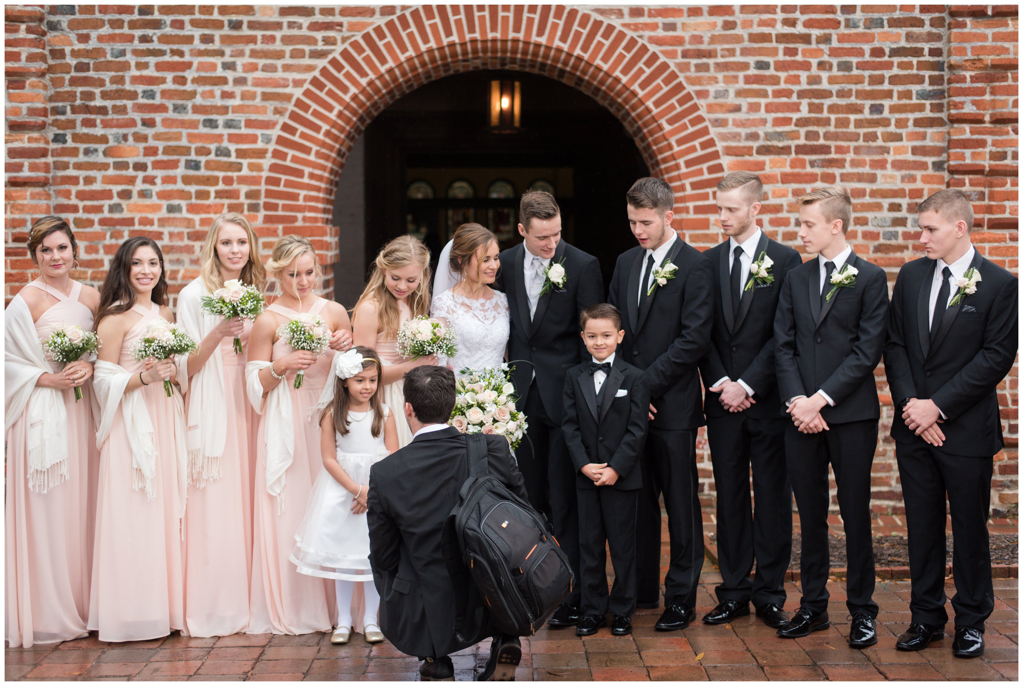 hampton roads wedding photographer talks with flower girl and bridal party at smithfield wedding