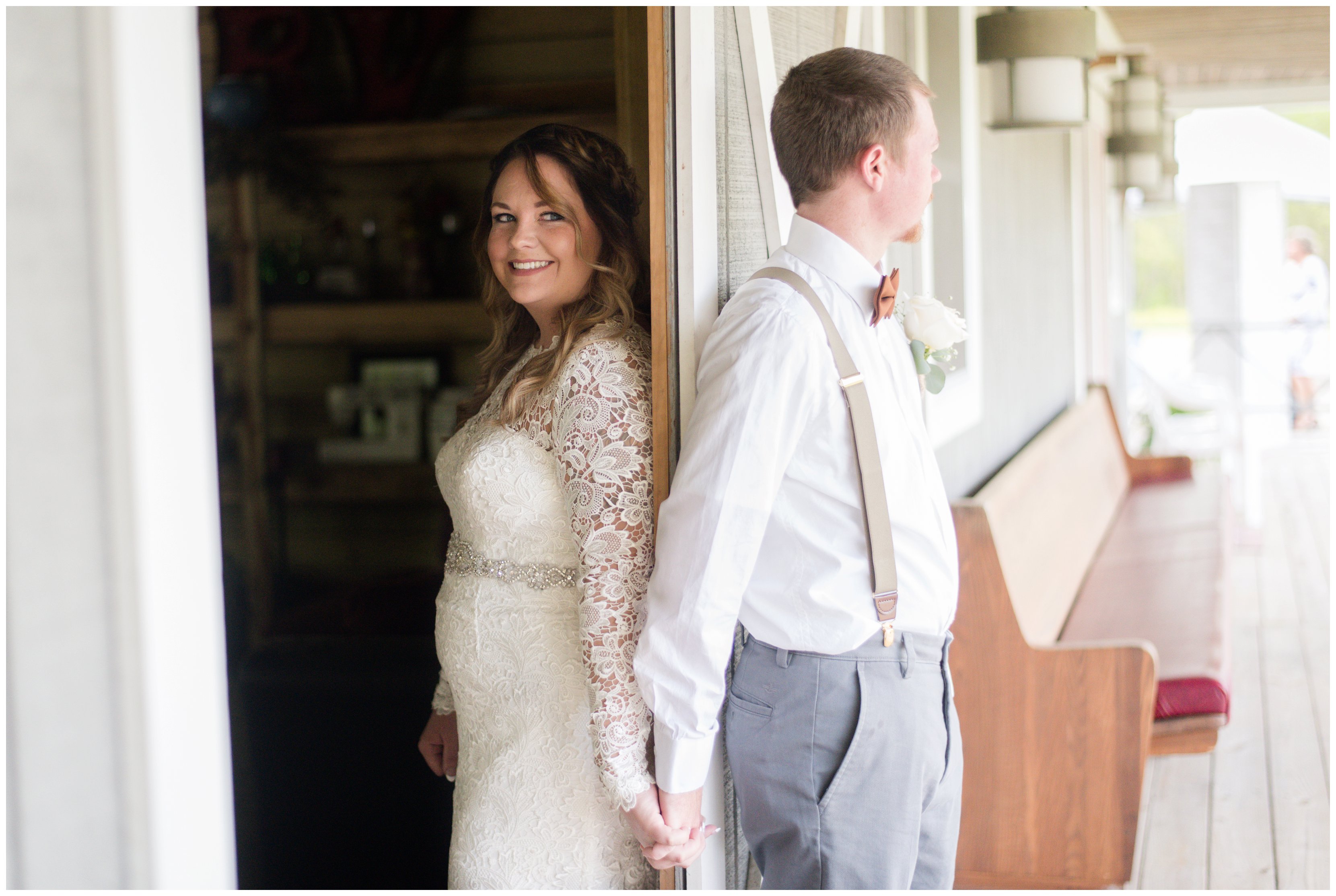 bride and groom holds hands around a door in chesapeake virginia
