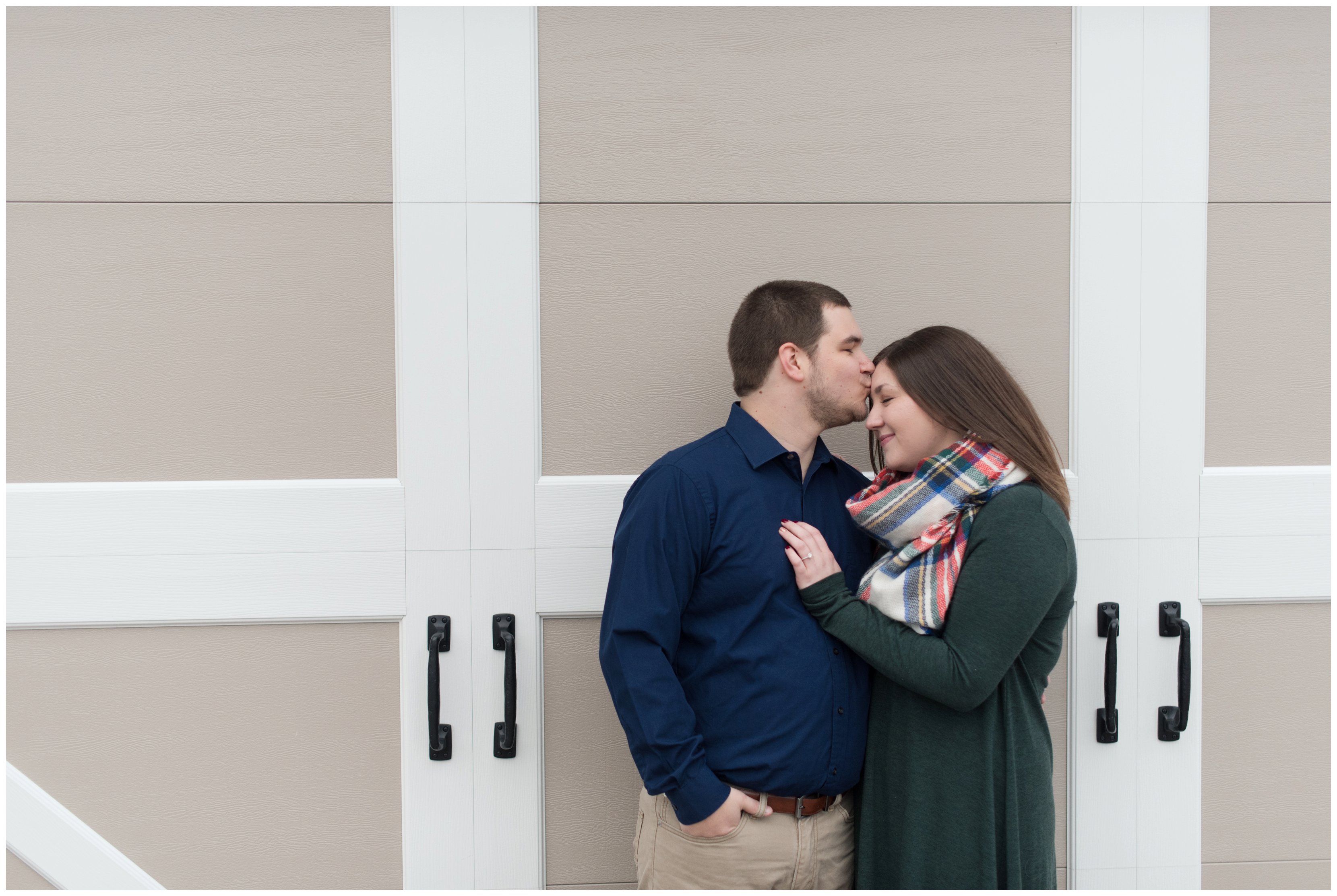 couple in front of barn at smithfield engagement session by virginia wedding photographer